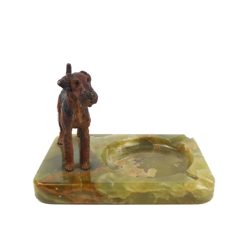 602 - A cold-painted model of an Airedale on a green onyx base, circa 1950.