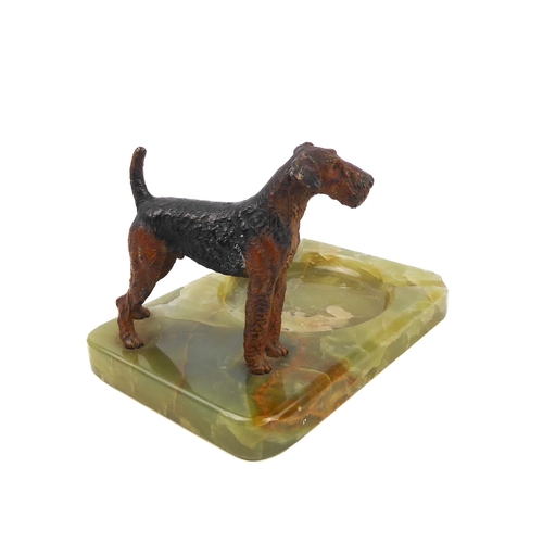 602 - A cold-painted model of an Airedale on a green onyx base, circa 1950.