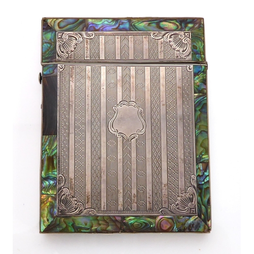 604 - A silver, abalone shell and mother of pearl card case