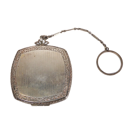 607 - A sterling silver decorative compact and chain