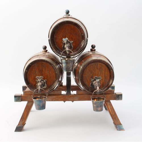 609 - A coopered oak and silver-plated three-barrel tabletop spirit dispenser stand - early 20th century, ... 