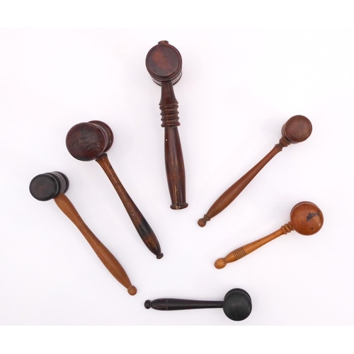 619 - A small collection of treen turned wooden gavels - in a variety of woods including boxwood, first ha... 