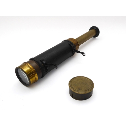 628 - A leather and brass three draw pocket telescope - early 20th century, unsigned, with turned ebony ey... 