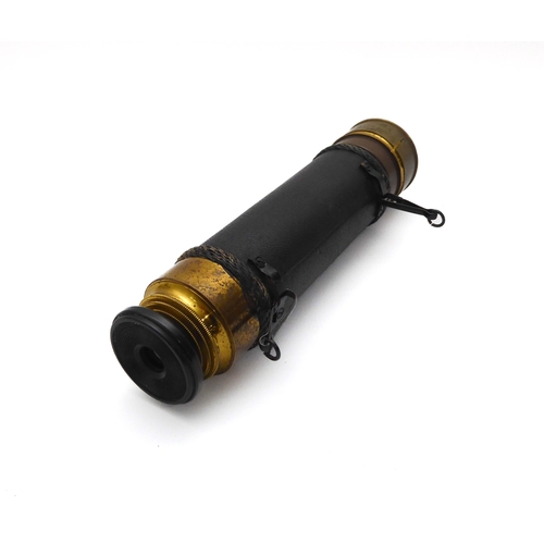 628 - A leather and brass three draw pocket telescope - early 20th century, unsigned, with turned ebony ey... 