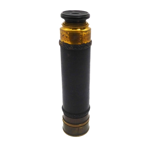 628 - A leather and brass three draw pocket telescope - early 20th century, unsigned, with turned ebony ey... 