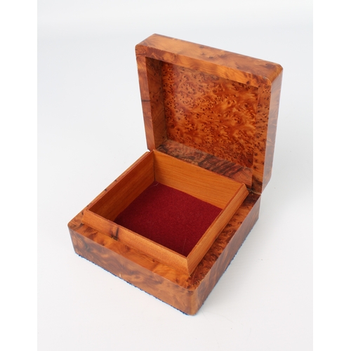 631 - A burr amboyna box with Ferrari prancing horse emblem (LWH 14 x 13.7 x 7.5 cm)