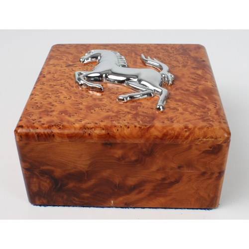 631 - A burr amboyna box with Ferrari prancing horse emblem (LWH 14 x 13.7 x 7.5 cm)