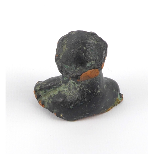 643 - A bronze glazed terracotta bust of Christ, possibly a pilgrim piece, 4 cm high