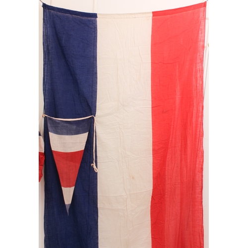 667 - A vintage tricolour banner (2.2 x 1.0 m) and 9.5 metres of matching pennant bunting (22 pennants, ea... 