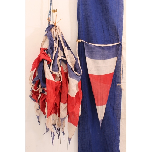 667 - A vintage tricolour banner (2.2 x 1.0 m) and 9.5 metres of matching pennant bunting (22 pennants, ea... 