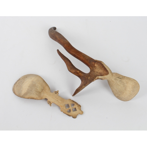 673 - A Sami Lapland carved reindeer antler spoon - the pear-shaped bowl with engraved pictorial of a rein... 