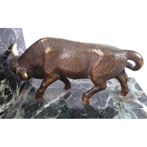 679 - A pair of bronze and marble bookends - second half 20th century, the bulls with mid-brown and golden... 