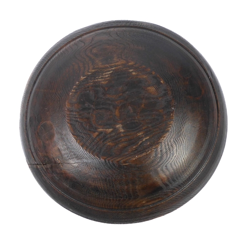 680 - A large turned wooden bowl, probably African - mid-20th century, one side with a copper wire stitche... 