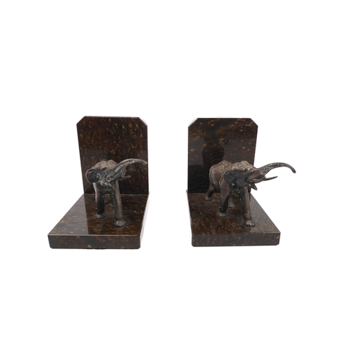 681 - A pair of cast white metal and marble elephant bookends - late 20th century, the elephants modelled ... 