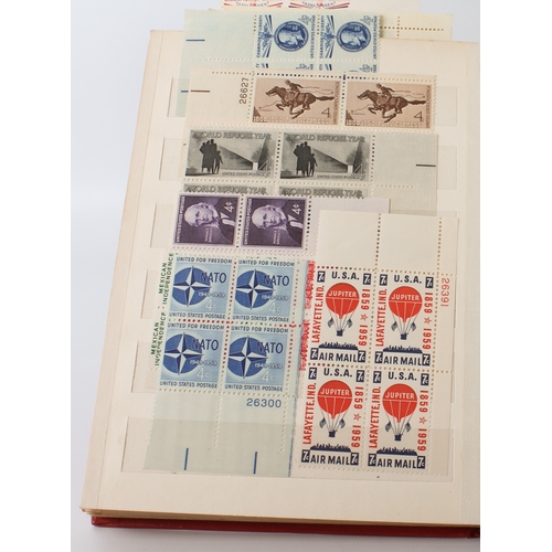 699 - A large collection of stamps:
 a stock album containing 71 USA blocks of four (mostly 1960-1980);
 2... 