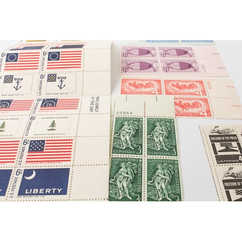 699 - A large collection of stamps:
 a stock album containing 71 USA blocks of four (mostly 1960-1980);
 2... 