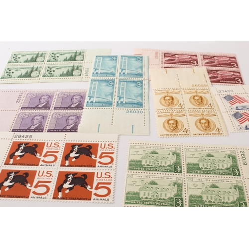 699 - A large collection of stamps:
 a stock album containing 71 USA blocks of four (mostly 1960-1980);
 2... 