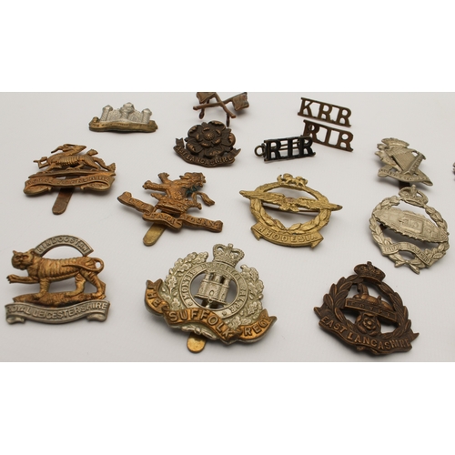 703 - Twenty British Army cap and other badges, mostly first half of the 20th century:
 The Cambridgeshire... 