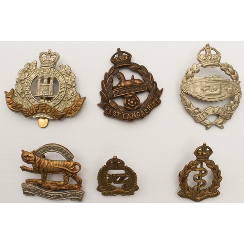 703 - Twenty British Army cap and other badges, mostly first half of the 20th century:
 The Cambridgeshire... 