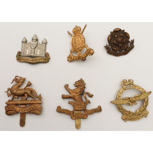 703 - Twenty British Army cap and other badges, mostly first half of the 20th century:
 The Cambridgeshire... 