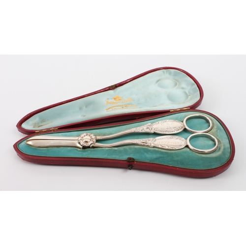 153 - A cased pair of late Victorian silver grape scissors - Mappin & Webb, Sheffield 1896, with rose-form... 