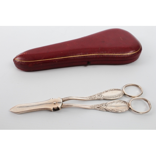 153 - A cased pair of late Victorian silver grape scissors - Mappin & Webb, Sheffield 1896, with rose-form... 