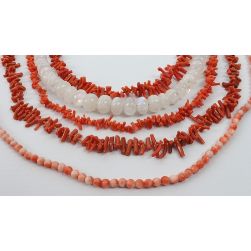 192 - A small collection of vintage coral and moonstone necklaces - comprising a graduated moonstone bead ... 