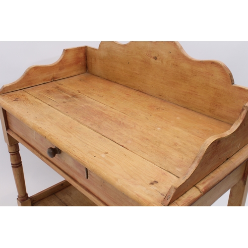 466 - A Victorian waxed pine washstand - with shaped three-quarter gallery, single frieze drawer and pot s... 