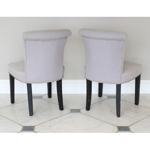 506 - A pair of 'Made' button back side chairs - with flared, buttoned scroll backs and seats in pale grey... 