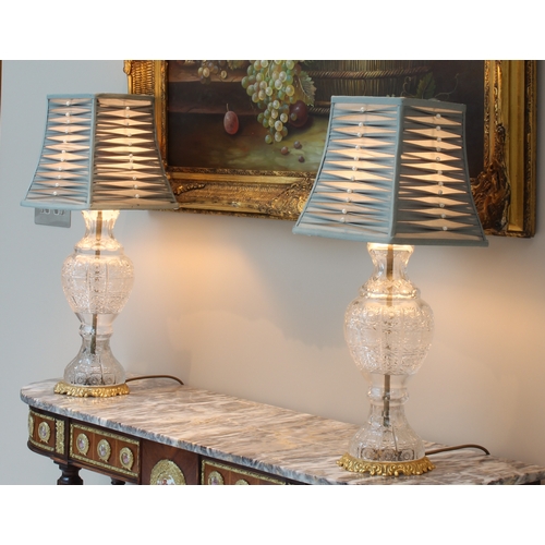 545 - A pair of cut glass and gilt brass lamps - late 20th century, in the 19th century style, the baluste... 