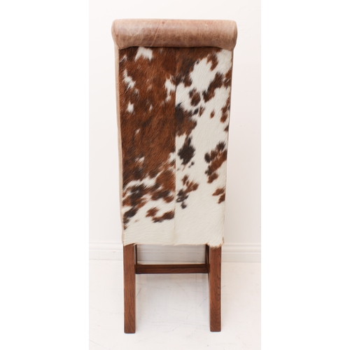 455 - A set of six rollback tan leather and cow hide dining chairs by Indigo of Matlock.