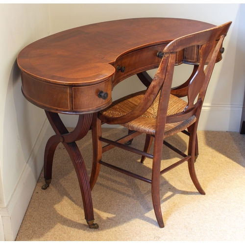 452 - An Edwardian cross banded mahogany kidney shaped writing or dressing table - the cross banded and bo... 