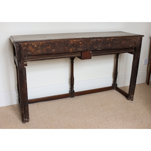 453 - An early 18th century and later joined oak dresser base of small proportions - the moulded, single p... 