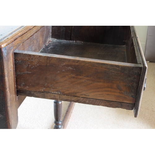 453 - An early 18th century and later joined oak dresser base of small proportions - the moulded, single p... 