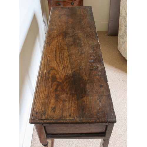 453 - An early 18th century and later joined oak dresser base of small proportions - the moulded, single p... 