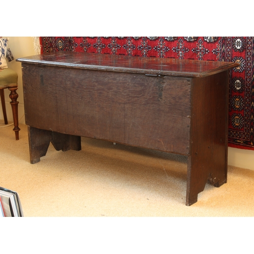 448 - A late 17th century boarded oak chest - the moulded, single plank top with later hinges, over plain ... 