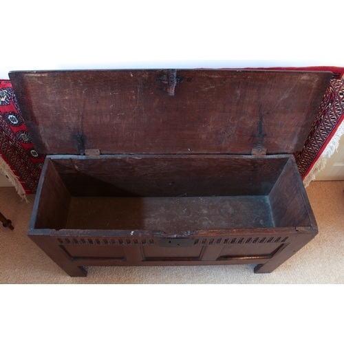 448 - A late 17th century boarded oak chest - the moulded, single plank top with later hinges, over plain ... 