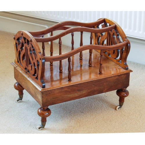 442 - A Victorian walnut Canterbury - with three serpentine divisions on turned supports and fretwork ends... 