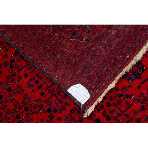 565 - An Afghan Biljik rug - retailed by G. H. Frith Ltd., with four rows of five star shaped medallions, ... 