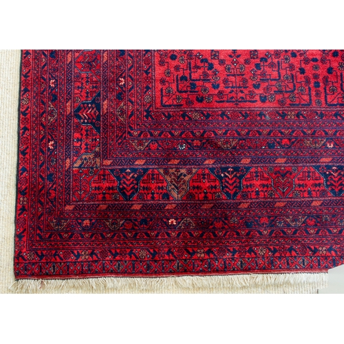 565 - An Afghan Biljik rug - retailed by G. H. Frith Ltd., with four rows of five star shaped medallions, ... 