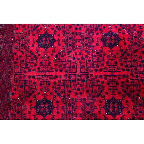 565 - An Afghan Biljik rug - retailed by G. H. Frith Ltd., with four rows of five star shaped medallions, ... 