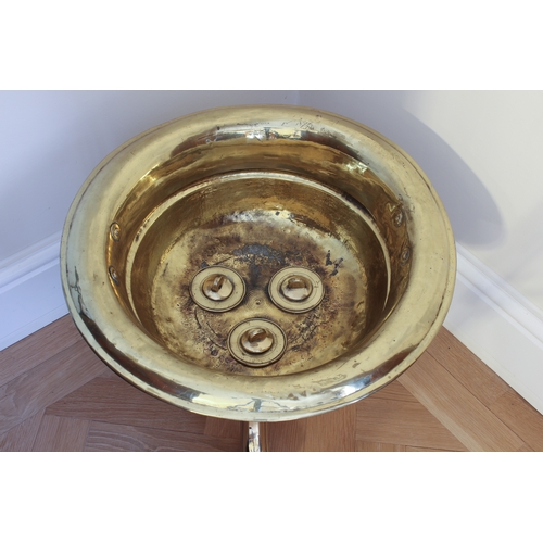 582 - A 19th century brass urn-form wine cooler - the circular, cupped bowl with everted rim, central gird... 