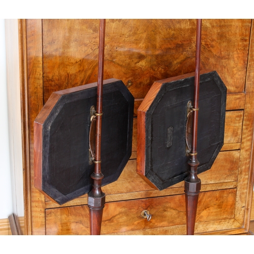 429 - A fine pair of Regency mahogany pole screens in the Sheraton manner - the octagonal screens with sil... 