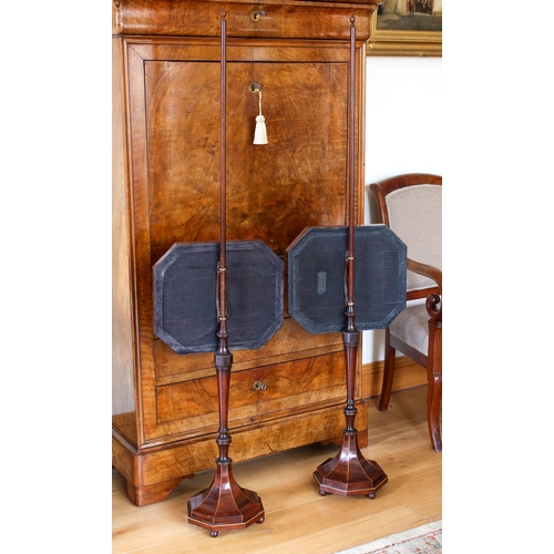 429 - A fine pair of Regency mahogany pole screens in the Sheraton manner - the octagonal screens with sil... 