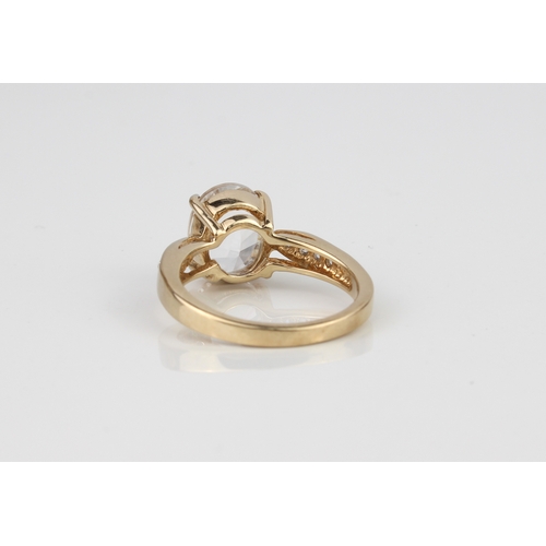 213 - A 9ct gold ring set with a large white stone - hallmarked Birmingham 2008, size N.