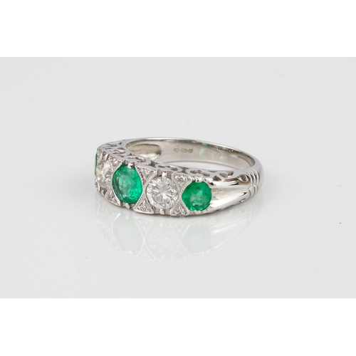 227 - A fine quality 18ct white gold, emerald and diamond ring - Birmingham hallmarks, with three graduate... 