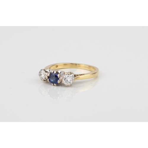 226 - A fine 18ct gold three-stone ring, set with a well-coloured central sapphire (approx. .30 ct) and tw... 