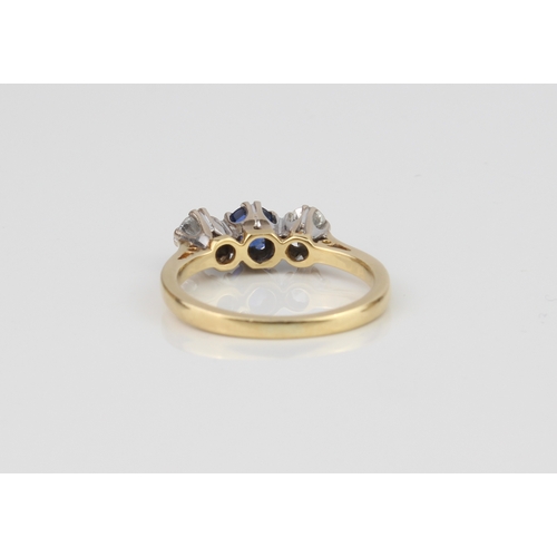 226 - A fine 18ct gold three-stone ring, set with a well-coloured central sapphire (approx. .30 ct) and tw... 