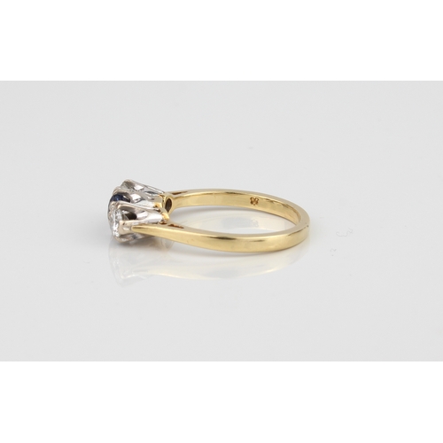 226 - A fine 18ct gold three-stone ring, set with a well-coloured central sapphire (approx. .30 ct) and tw... 