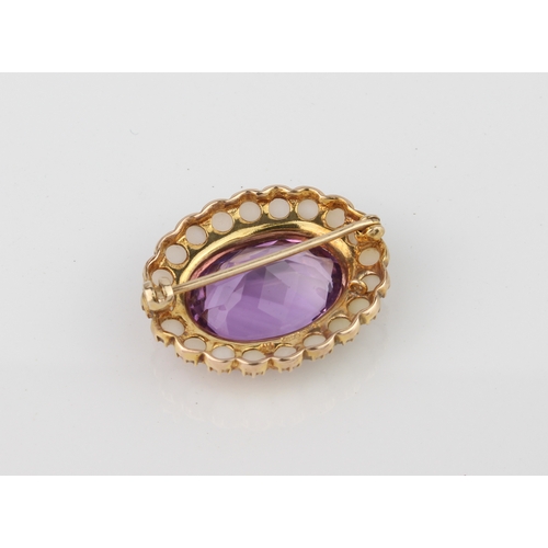 247 - A 9ct gold, amethyst and seed pearl brooch - hallmarked London 1964, 27mm long.